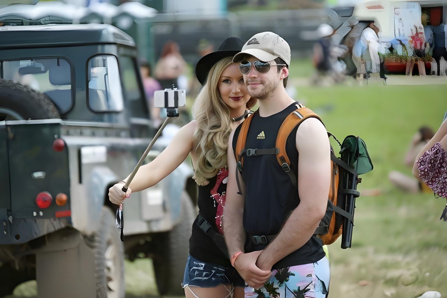 Couples use selfie stick to take selfies