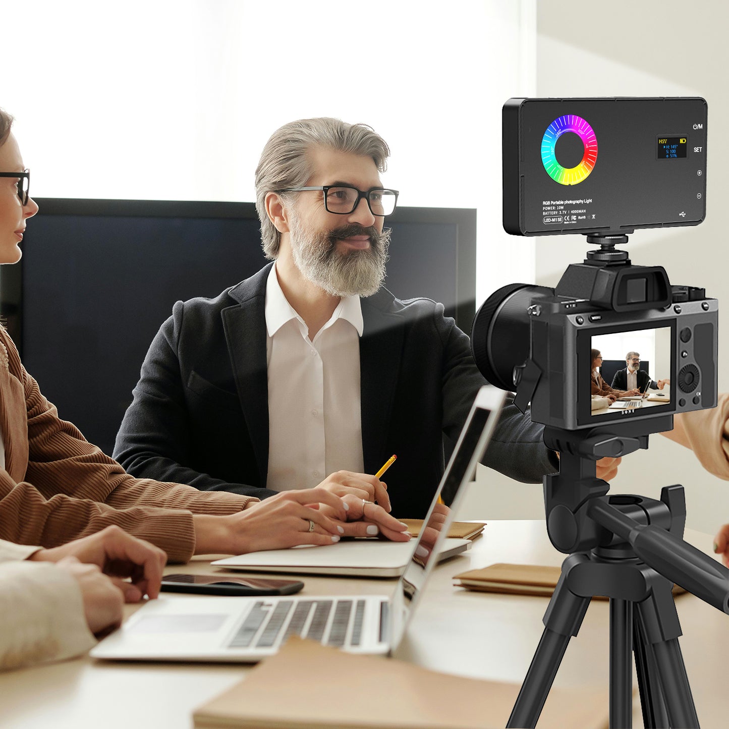 Office staff uses a ring light for live video meetings.