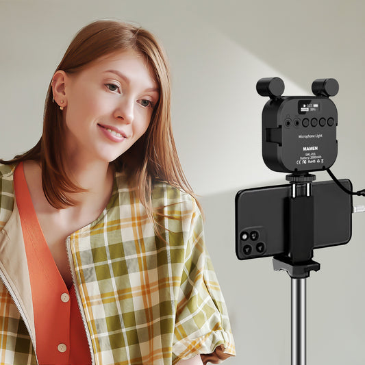 A girl is live streaming with a ring light equipped with a microphone on a stand.